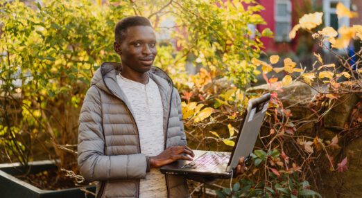 A man holding a laptop